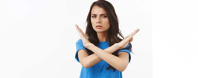 woman making a "no" gesture